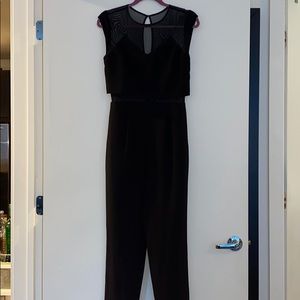 Black sleeveless jumpsuit w mesh neck / waist